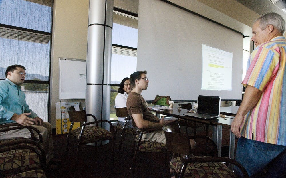 	Student Andrew Marcum, far left, asks Mayor Martin Chávez, far right,  about University-community relations during a GPSA meeting Saturday at the Continuing Education Building. Marcum’s American studies class published a report on the topic Wednesday. 