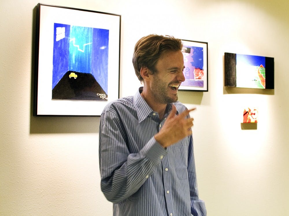 	Charles Ellis’ artwork hangs in the lower level of the SUB. The collection aims at displaying surreal scenarios using colors commonly used in video game graphics. 