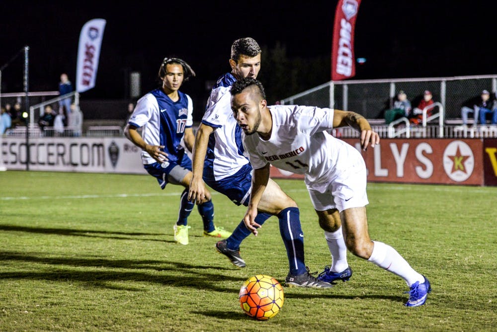 Senior forward Niko Hansen looks back towards his teammates after evading two LMU players on Tuesday, Oct. 4, 2016 at the UNM Soccer Complex. The Lobos will play FAU this Saturday.