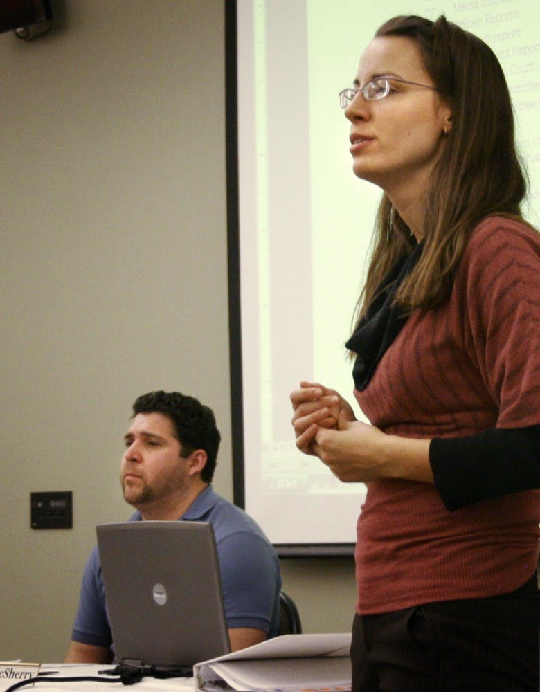 GPSA President Joseph Garcia listens to Erin McSherry, pro tem chairwoman of the council, speak at a meeting Saturday. 