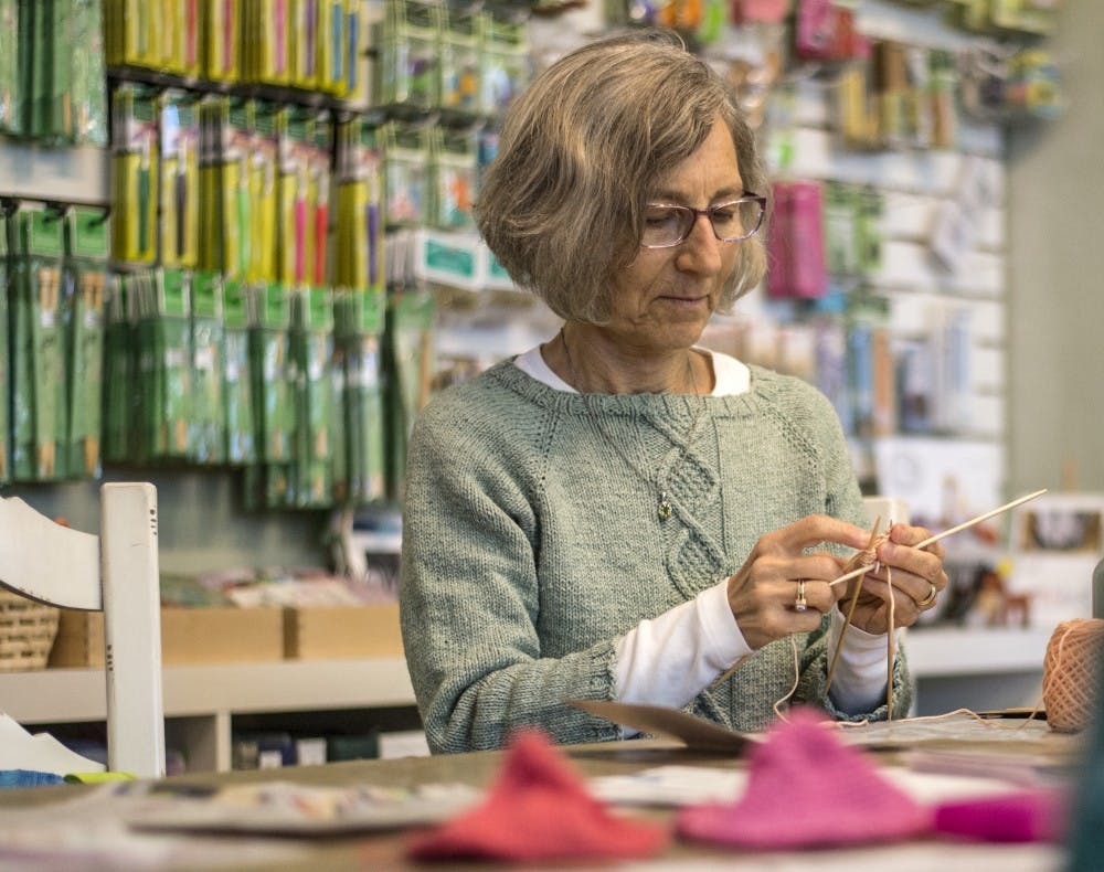 Sarah Fitzpatrick works on a knit prosthetic for breast cancer survivors at the Nob Hill Yarn Store Tuesday afternoon. Fitzpatrick was accompanied by Sara Kirkish who oversees Knitted Knockers a foundation aimed to provide more comfortable knitted solutions to the already existing prosthetics offered.&nbsp;