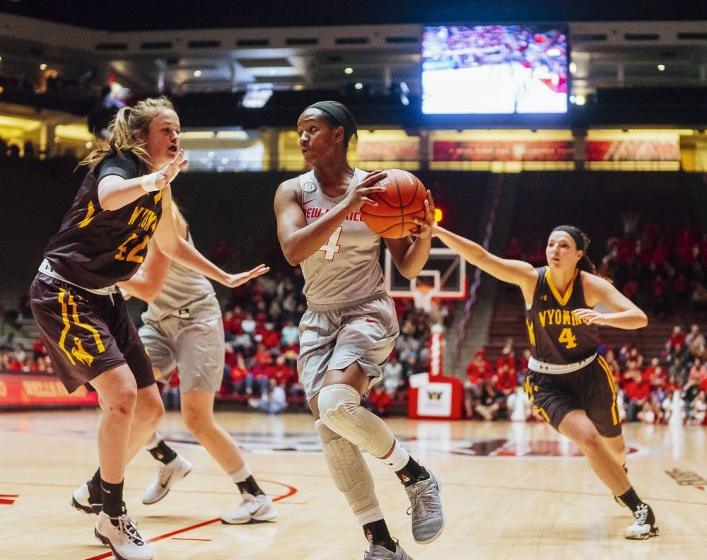 Alex Lapeyrolerie makes attempts to amke a layup within the interior defense against Wyoming on Feb 25th at WiesPies Arena