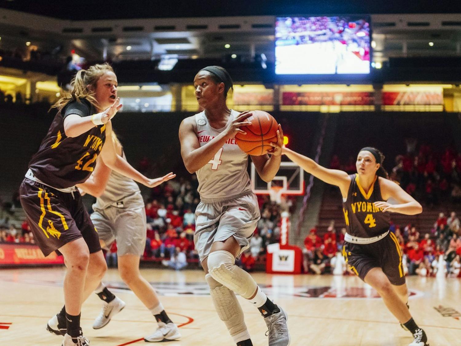 Alex Lapeyrolerie makes attempts to amke a layup within the interior defense against Wyoming on Feb 25th at WiesPies Arena