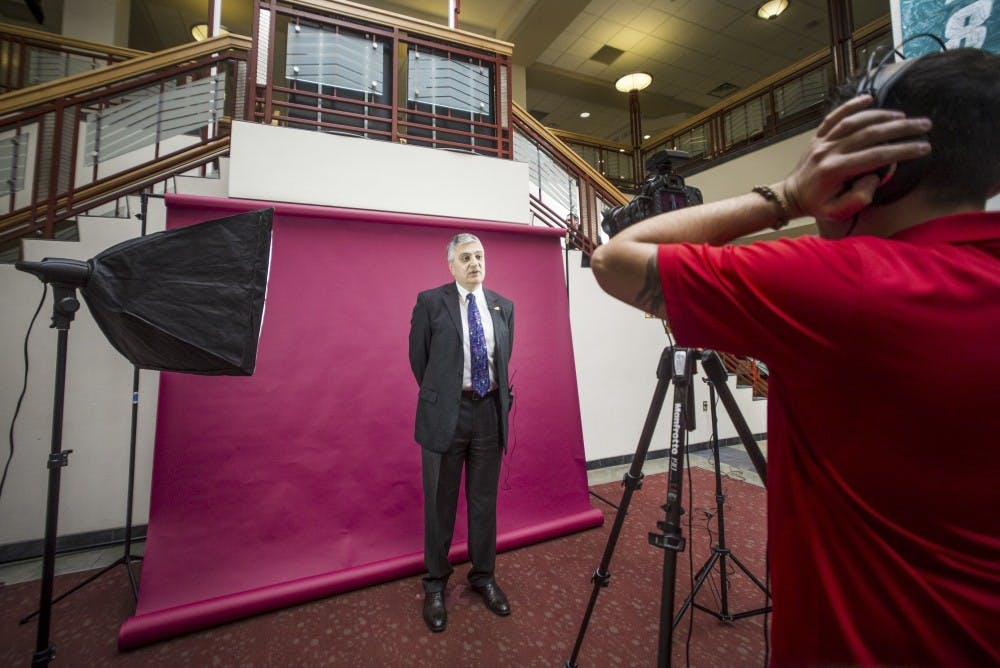University President Chaouki Abdallah speaks in front of a camera as part of a project to promote international students on Feb. 8, 2017 in the UNM SUB Atrium.
