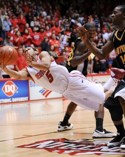 Point guard Dairese Gary draws a foul during UNM's 60-58 win over Southern Mississippi. Gary scored 13 points, including the game-winning free throws that boosted the Lobos to victory.