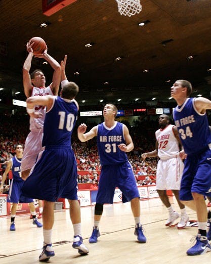 Roman Martinez shoots over Air Force's Andrew Henke in the Lobos' 78-53 stomp at The Pit on Saturday. Air Force entered the contest as the third-ranked team in 3-point efficiency, but the Lobos outshot them 56.3 percent to 33.3 percent from deep.
