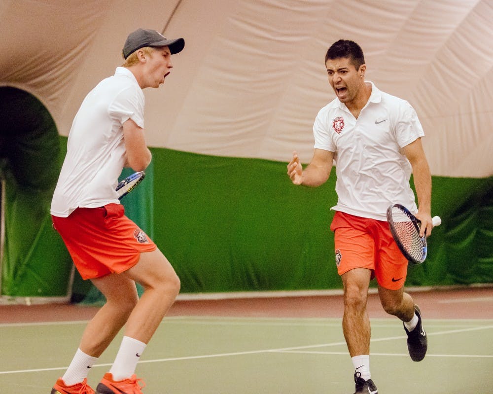 Dominic West and Jorge Escutia celebrate game point against NMSU on Feb 25th