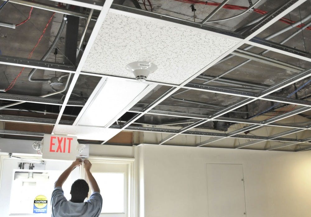 	Carlos Villa, janitor, does minor repairs in Mesa Visa Hall Wednesday afternoon. Mesa Vista is one of many buildings on campus in need of malignance and renovations.