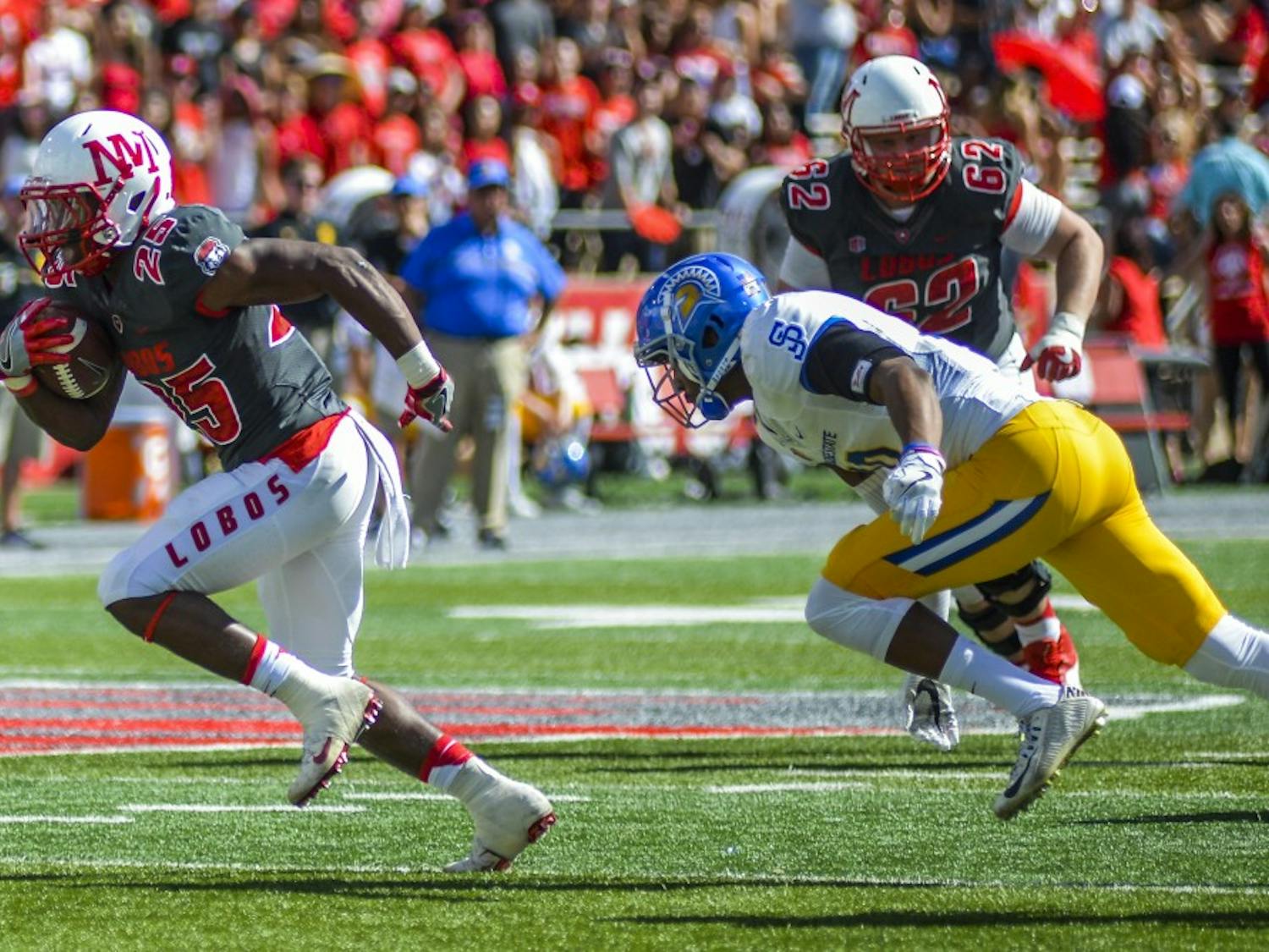 Redshirt sophomore Tyrone Owens outruns a San José State defender on Saturday, Oct. 1, 2016 at University Stadium. The Lobos defeated the San Jose State Spartans 48-41.