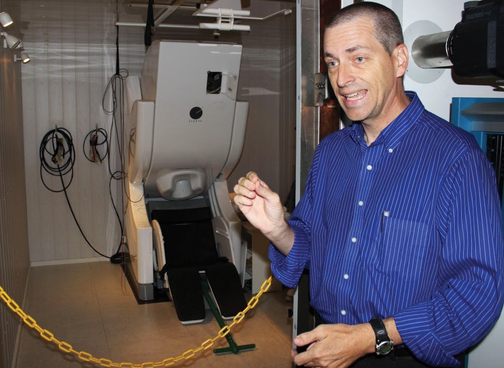 Vince Calhoun explains how a magneto encephalography (MEG) machine operates. Magneto encephalography (MEG) which is, equipment that measures the magnetic field changes produced by bundles of neurons firing in the brain.