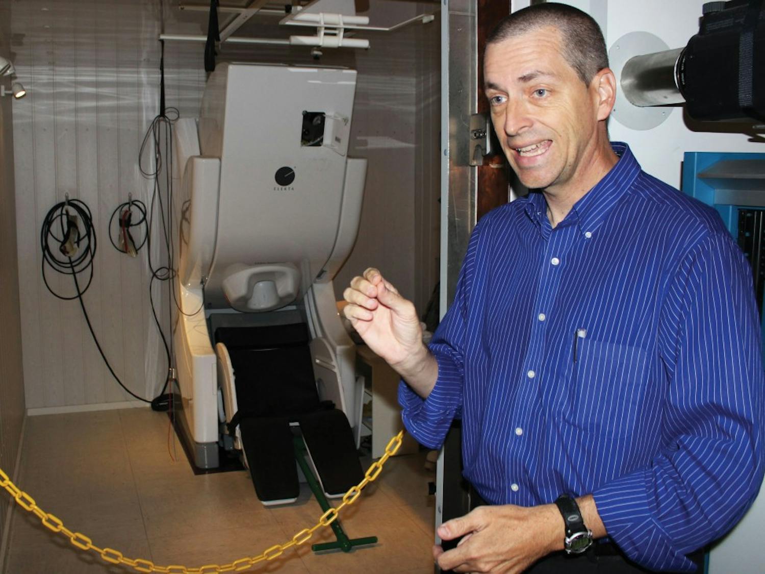 Vince Calhoun explains how a magneto encephalography (MEG) machine operates. Magneto encephalography (MEG) which is, equipment that measures the magnetic field changes produced by bundles of neurons firing in the brain.