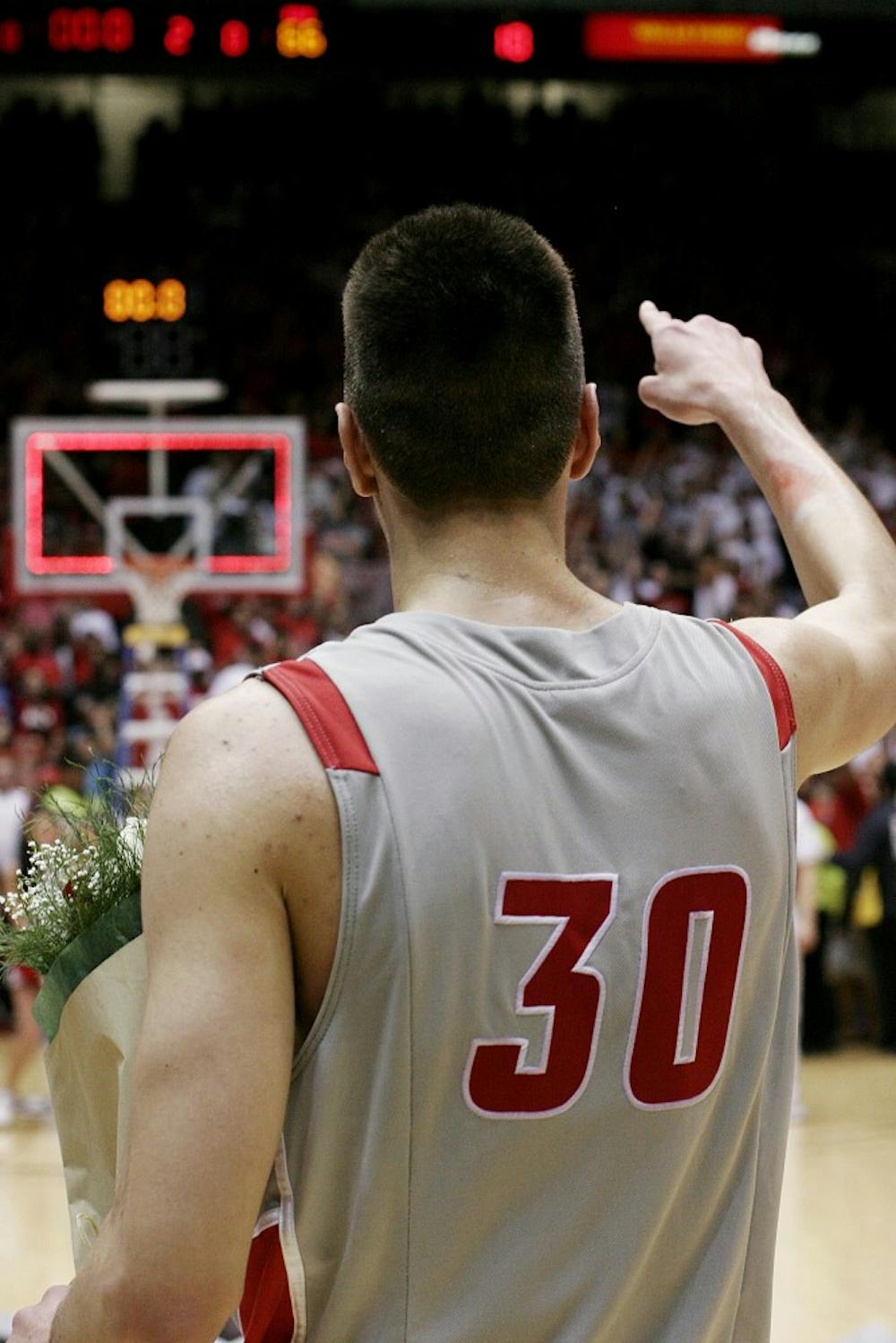 	Martinez, flowers in hand, points to the wild, sold-out Pit crowd at the conclusion of Wednesday’s game.