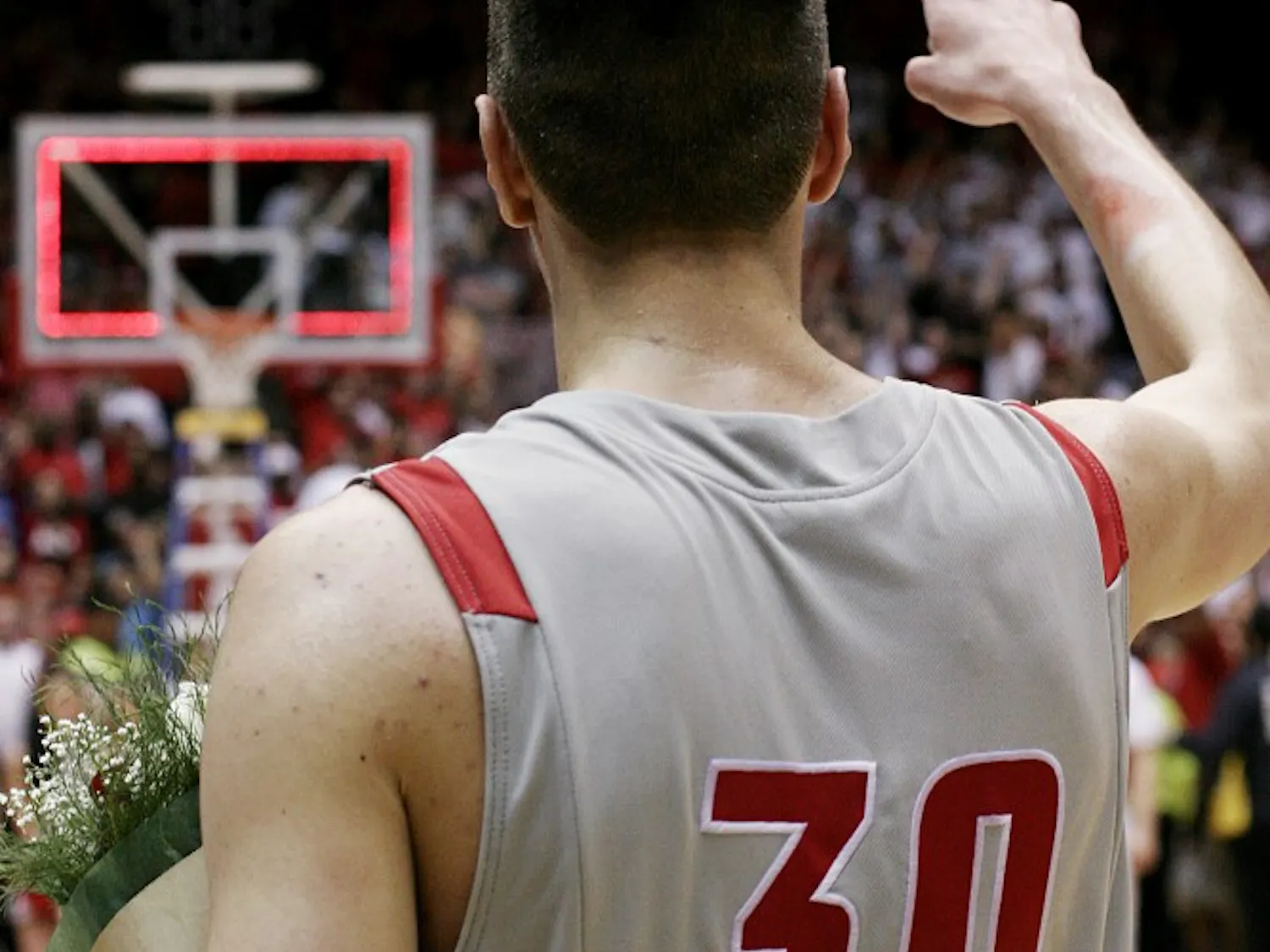 Martinez, flowers in hand, points to the wild, sold-out Pit crowd at the conclusion of Wednesday’s game.
