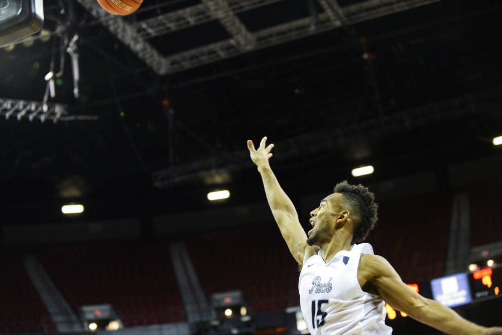 Senior D.J. Fenner leaps through the air in an attempt to tip the ball into the basket during Nevada’s championship game against CSU on Saturday, March 11, 2017 in Las Vegas, Nevada.