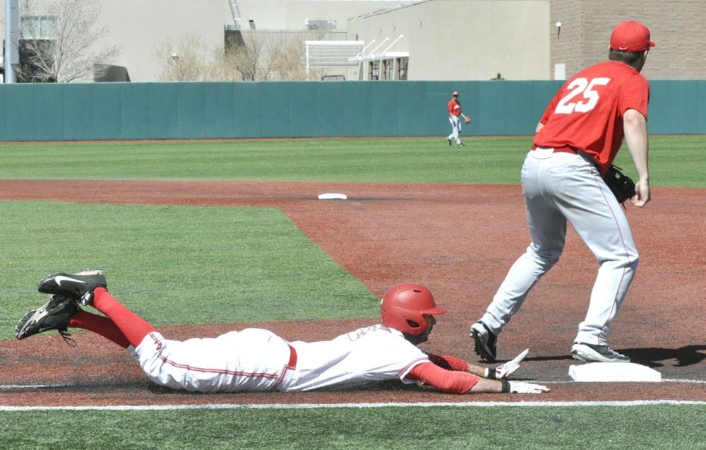 Sophomore outfielder Danny Collier slides into first base during Sundays game against Houston. 