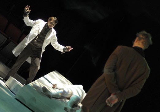 From left, Theodore Jackson as Victor Frankenstein, Amanda Machon as Elizabeth and Drew Pollock as the Professor rehearse "Frankenstein" in Popejoy Hall on Tuesday.