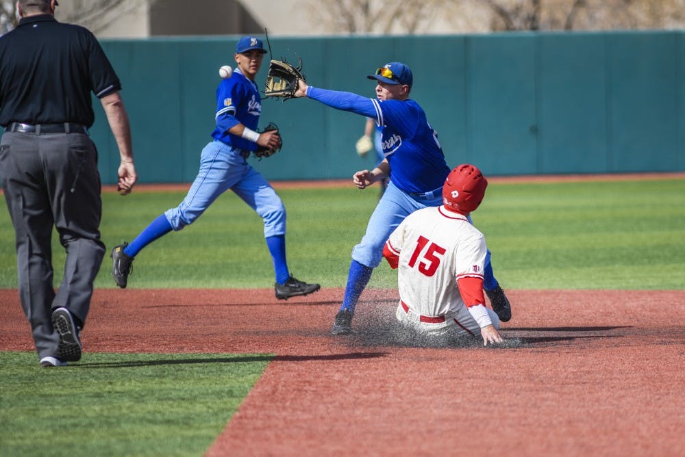 Sophomore Jared Mang slides into second base as a SJSU player attempts to out him Saturday, March 11, 2017 at Santa Ana Star Field. 