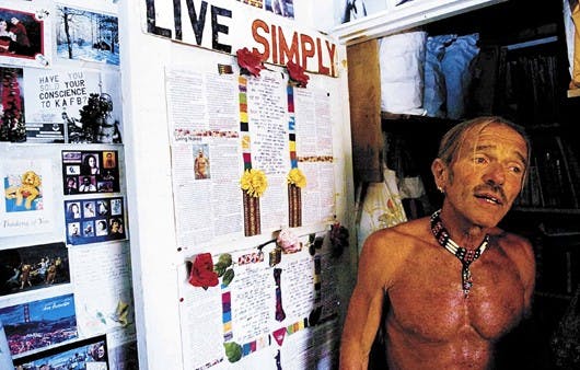 Don Schrader stands in his studio apartment Monday. 