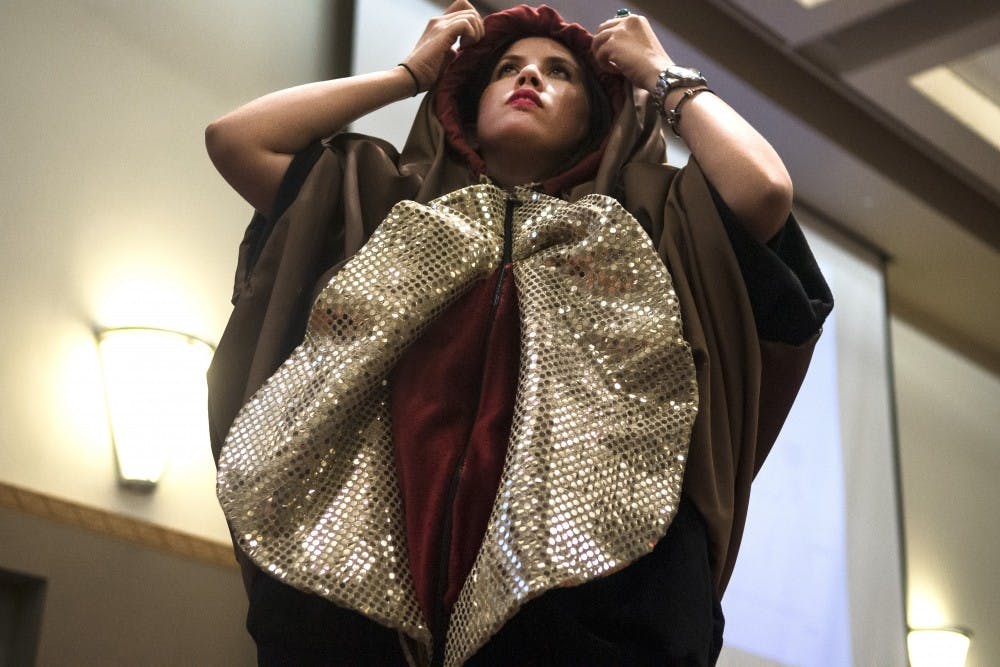 Tatiana Falcón-Rodríguez dresses up in a vulva costume during the “Todo Sobre Orgásmos” event on Monday. The costume allowed Falcón-Rodríguez to more easily point out features of the female anatomy to the people in attendance.