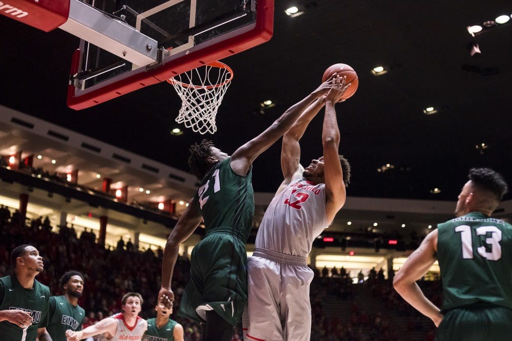 Lobos Foward Tim Williams (32) battles to make a shot against Eastern New Mexico Foward Arcaim Lallemand (21) at Wiespies Arena aka The Pit on November 4th 2016.