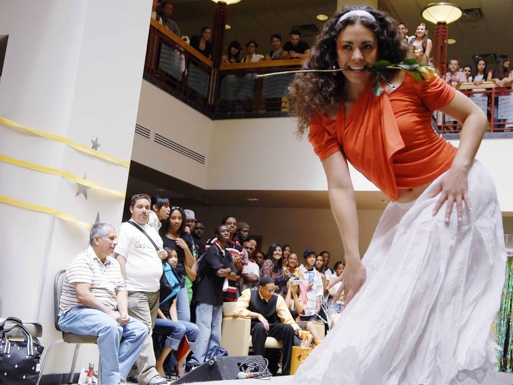 Julianne Apodaca poses at the end of the runway during Peaches and Cream Fashion Show sponsored by Black Men in Motion on Monday in the SUB.