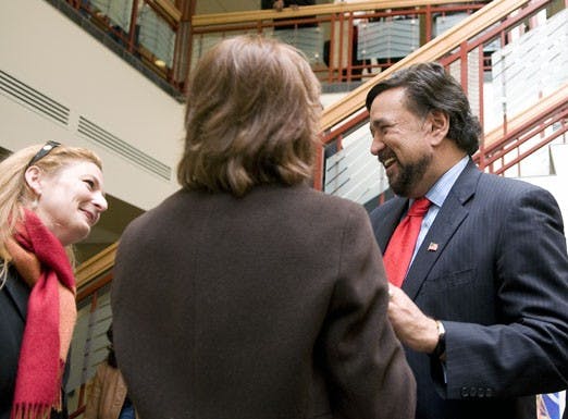 Gov. Bill Richardson greets Marjorie Devon, director of the Tamarind Institute, on Monday in the SUB.