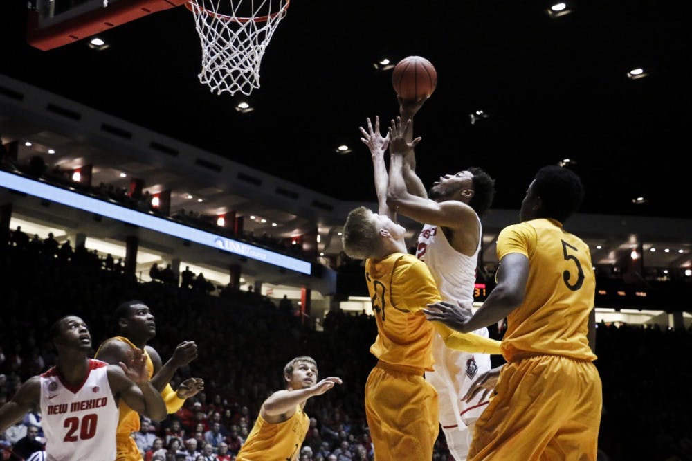 Redshirt senior Tim Williams drives to the net during the Lobos game against Wyoming University Saturday, Jan. 21, 2017 at WisePies Arena.&nbsp;