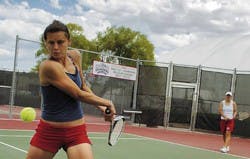 Iva Gersic, left, backhands the ball during practice at the UNM Tennis Complex on Friday. Gersic and her doubles partner, Maja Kovacek, are ranked No. 4 in the nation.
