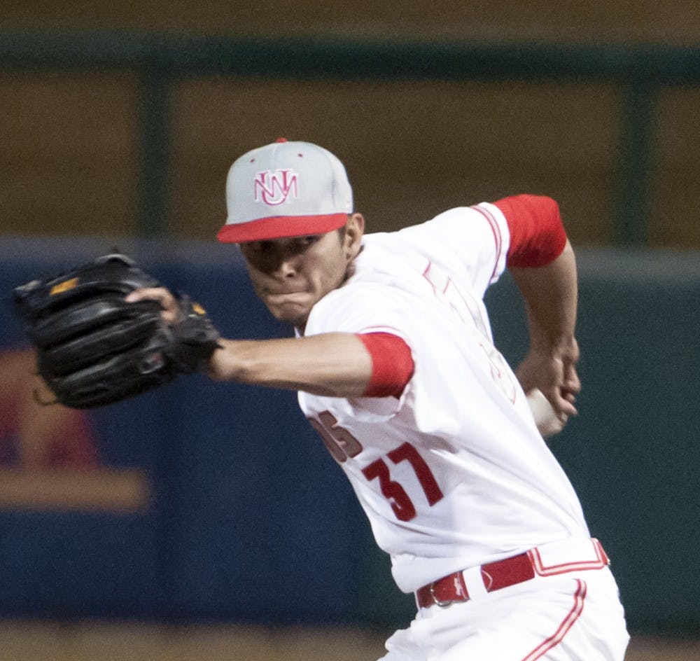 	UNM senior pitcher Josh Walker prepares to release a pitch against La Salle last year at Isotopes Park. The Lobos began the 2014 season at San Diego starting on Friday.