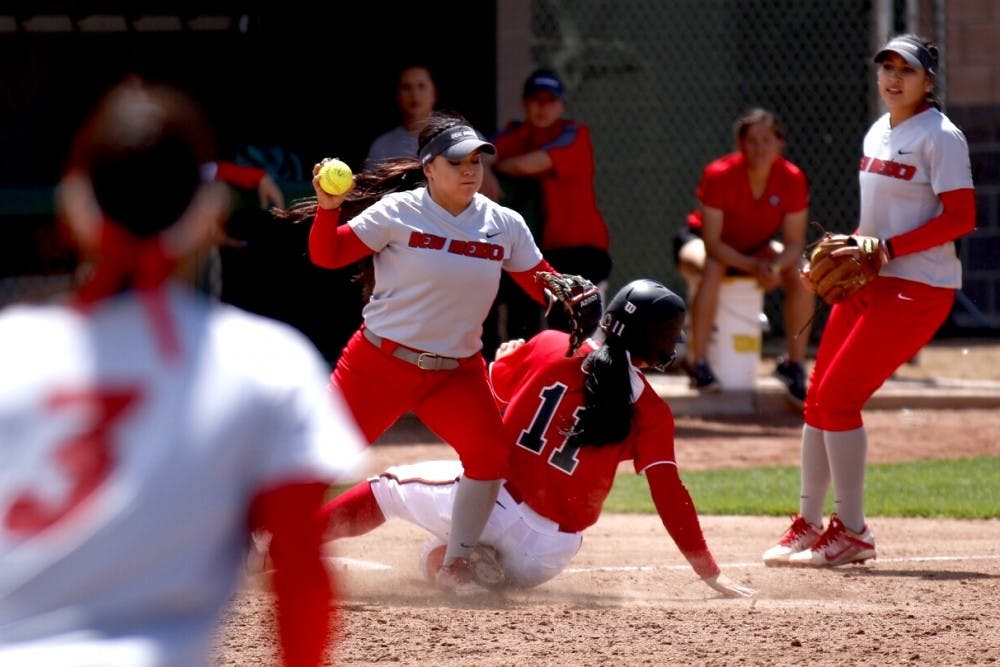 Junior Jasmin Casados prepares to throw the ball after a play at&nbsp;third base against&nbsp;UNLV Saturday afternoon at the Lobo Softball Field.&nbsp;The Lobos lost 7-6.&nbsp;