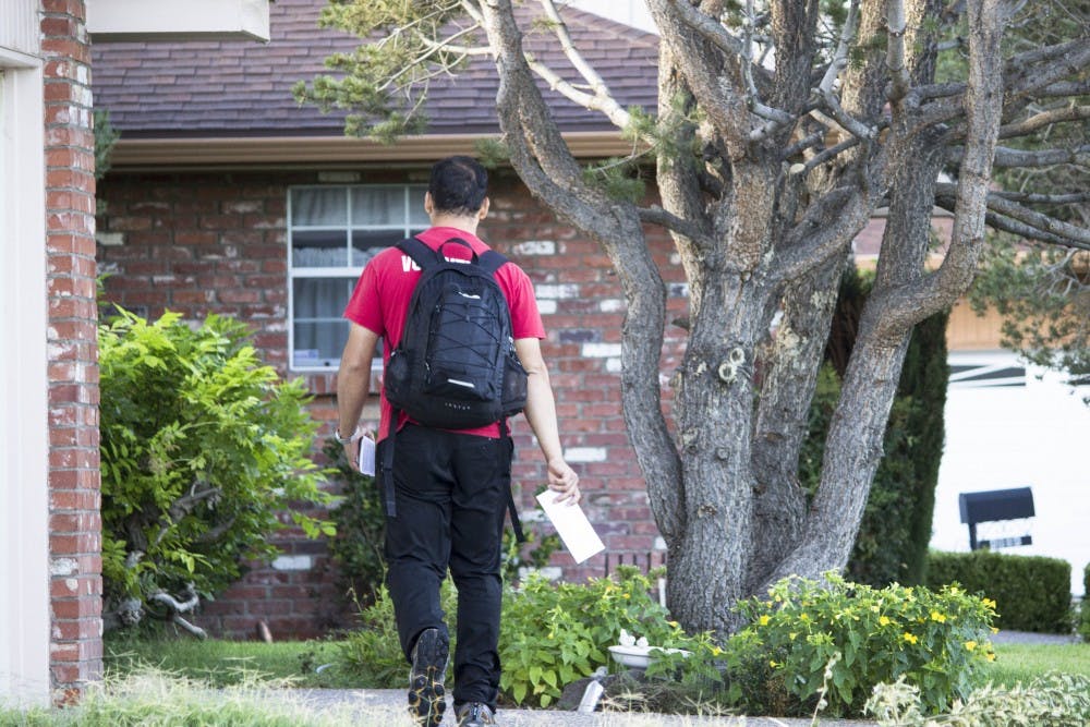 	Jose Moreira goes door to door early Monday morning to hand out flyers for the Gracias Christmas Cantata that is coming to Albuquerque in October. The Gracias Choir is highly acclaimed and will be performing at Tingley Coliseum at no cost. It relies upon donations to prepare for the event.