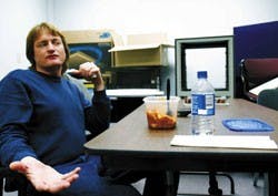 Shane Urioste, a distance education coordinator, eats lunch in the Media Technology Room in Woodward Hall on Tuesday. Urioste, who would be affected by the raise for UNM faculty and staff members that the House passed last week, said, "The raise doesn't m