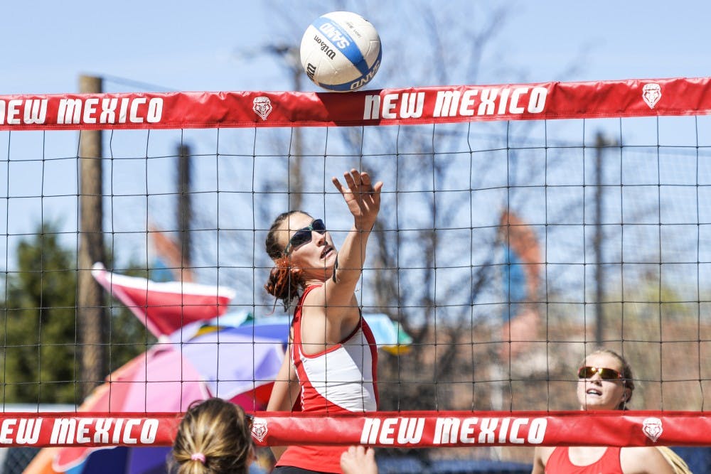 Junior Devanne Sours tips the ball over the net while playing MCU Friday March 18, 2016 at Lucky 66 Bowl’s sand volleyball courts. The Lobos will compete in the Battle On The Bayou this weekend in Baton Rouge, Louisiana.