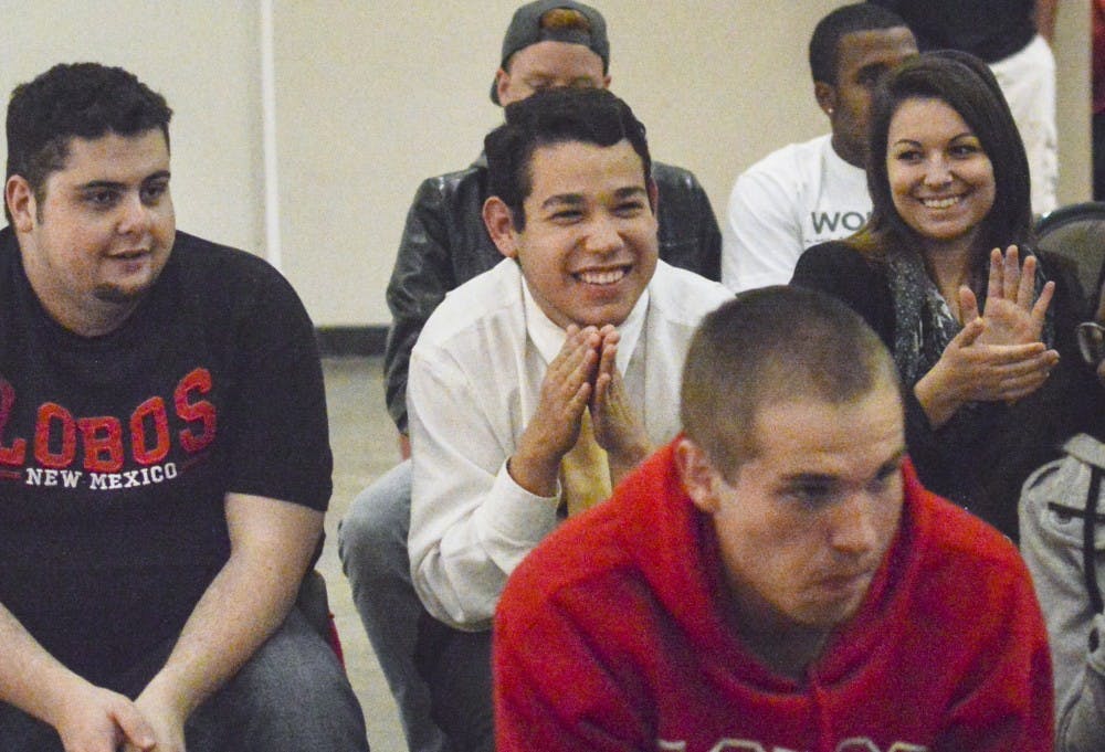 UNM mechanical engineering sophomore Jorge Guerrero, mid center, reacts after he learns he has the most votes in the election for Senator of the Associated Students of the University of New Mexico at the SUB on Wednesday night. Guerrero will be announced as the new senator at ASUNM’s last meeting of the semester.