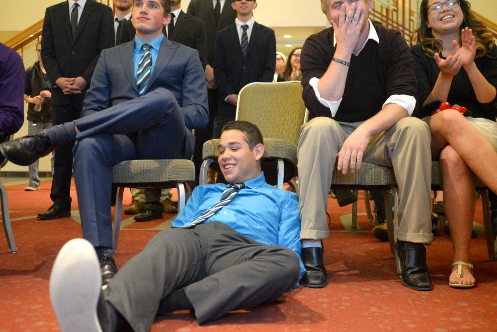 Jorge Guerrero falls out of his chair upon hearing he is reelected to the ASUNM Senate.