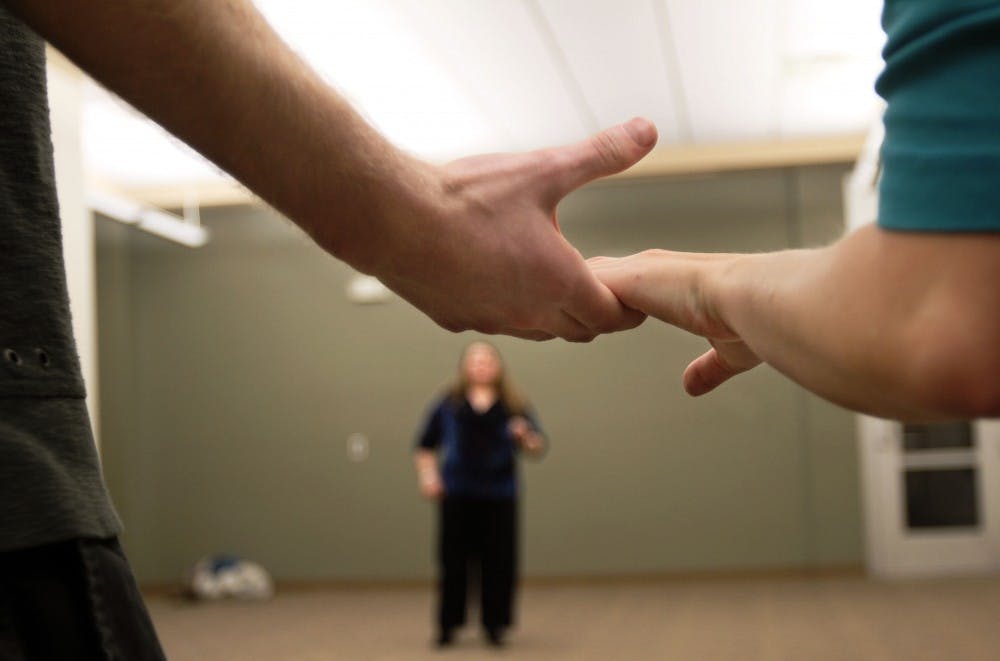 	Students Evan Root, left, and Natasha Glazener, right, begin the Amoroso dance steps, while Laura Smalley instructs them at a Society for Creative Anachronism meeting in the SUB on Monday. The Society will host a medieval workshop Saturday. 