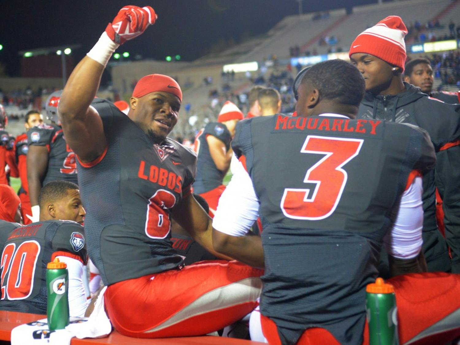 Redshirt senior running back Jhurell Pressley raises his hand to cheering fans after a 75 yard scoring run at University Stadium Saturday night. Pressley scored three touchdowns with 170 yards rushed to help aid the Lobos 47-35 victory over Air Force.