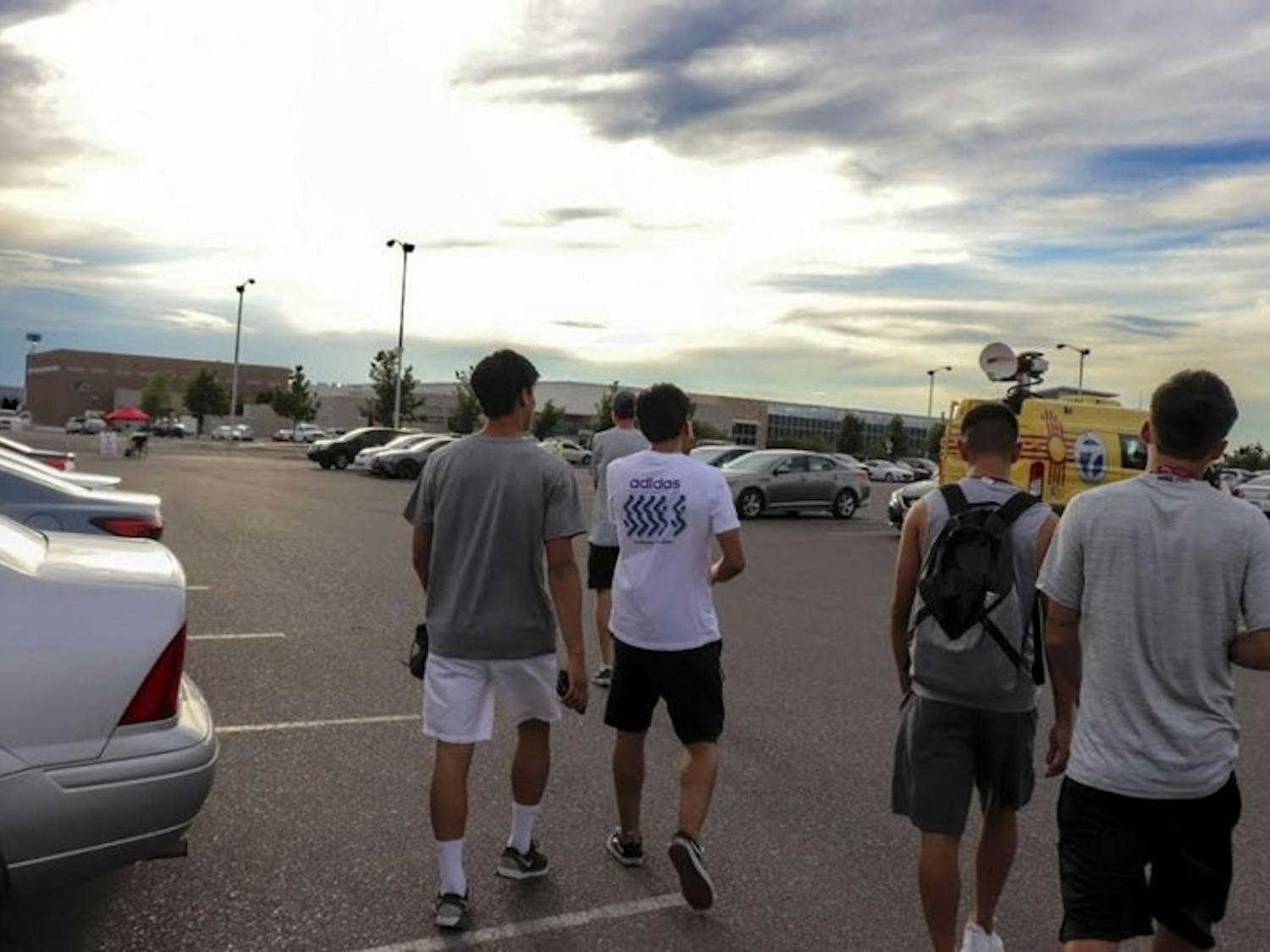 Members of the men's soccer team walk out of the Colleen J. Maloof Administration Building on Wednesday July 18, 2018, after being told that men's soccer was being recommended to be cut from UNM.