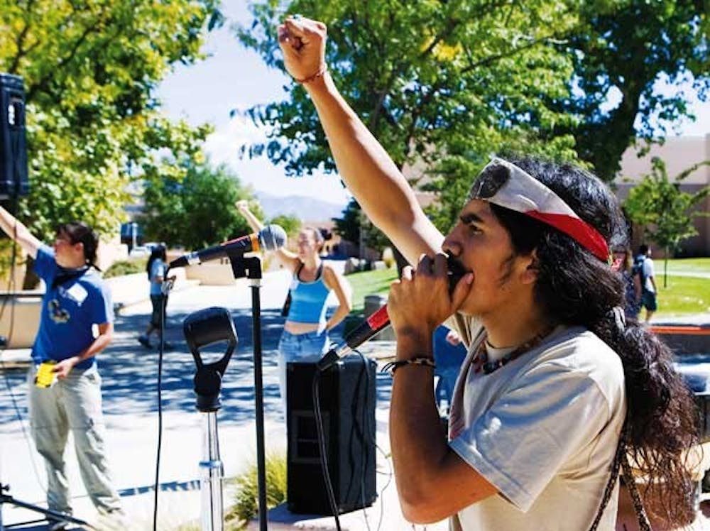 Travis McKenzie speaks to students during a march in front of the SUB on Monday.  