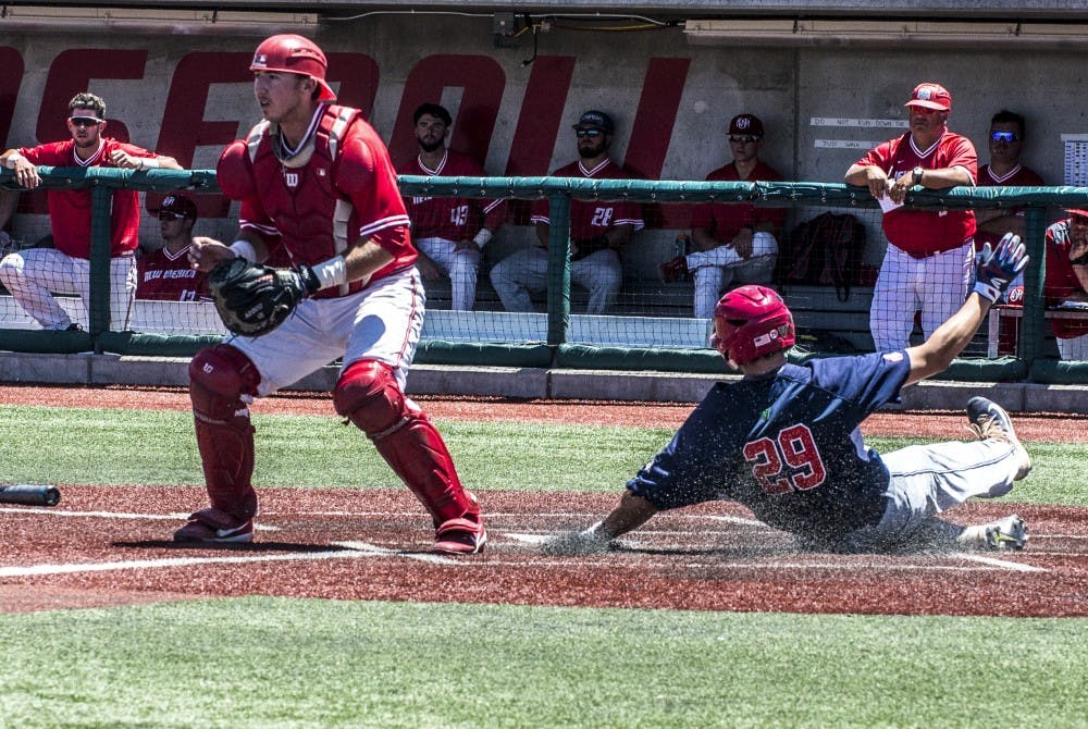Carter Bins, Fresno State catcher, scores a run during the losers bracket finals at the Mountain West Tournament at the Santa Ana Star Field.
