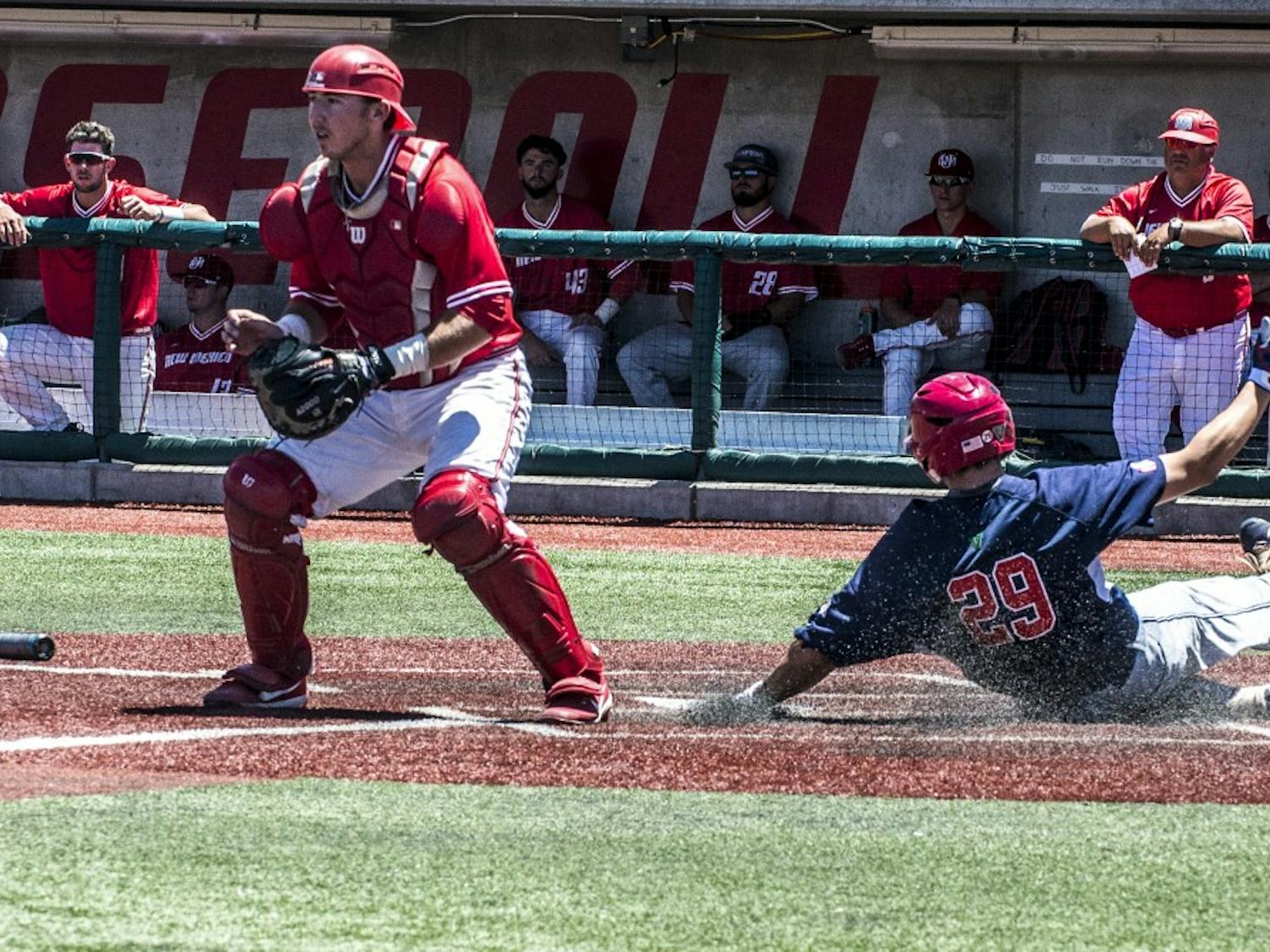 Carter Bins, Fresno State catcher, scores a run during the losers bracket finals at the Mountain West Tournament at the Santa Ana Star Field.