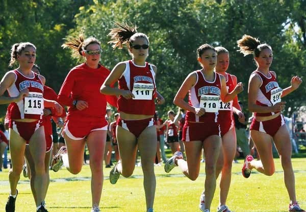 Members of the UNM Women's Cross Country Team warm up before the Mountain West Conference Championship at North Golf Course on Saturday. 