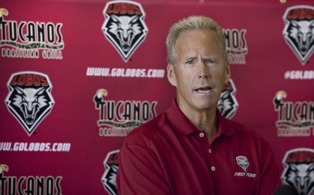 UNM head football coach Bob Davie speaks to the media during a press conference.