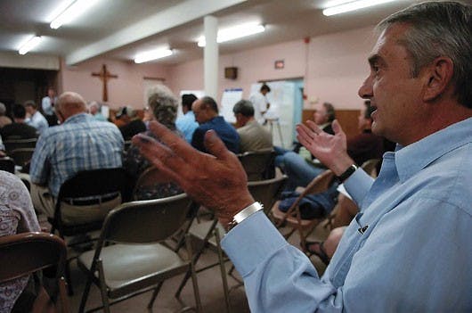 Albuquerque resident George Hannett voices his opposition to a proposed streetcar system during a public forum held Tuesday at Immanuel Presbyterian Church on Carlisle Boulevard.