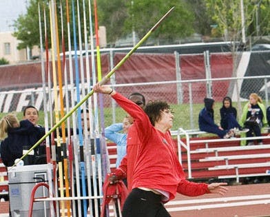 Katie Coronado launches a javelin during Saturday's track-and-field meet at the UNM Track Stadium. Coronado took first in women's javelin, and her teammate Anthony Fairbanks notched a first-place finish on the men's side.