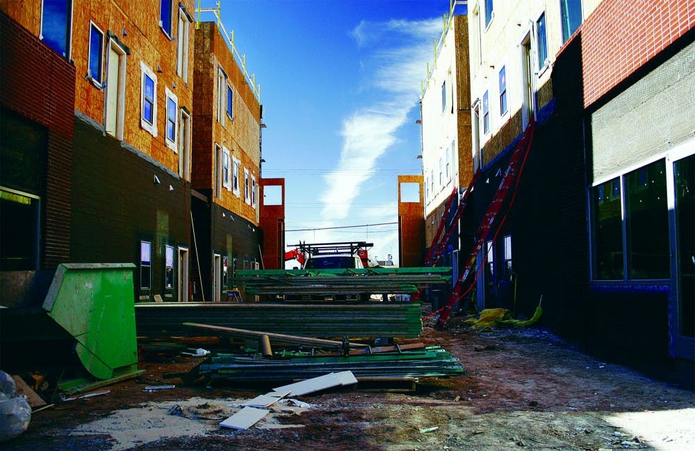 The Harvard Mall is expected to be completed in one month and open for business in six to eight and business owners in the Bricklight District are optimistic about the economic boost it might give the area.