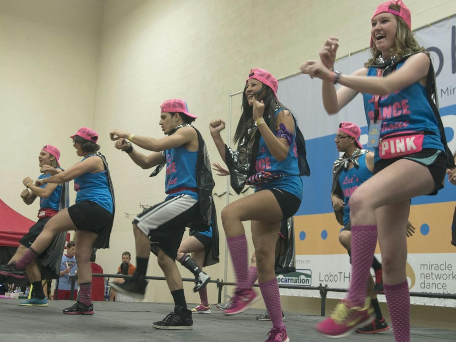 Group of UNM students dance on the stage at the LoboTHON Saturday at Johnson gym.  LoboTHON is an annual event held in order to raise donations for UNM Childrens Miracle Network Hospital. It raised $44,268.