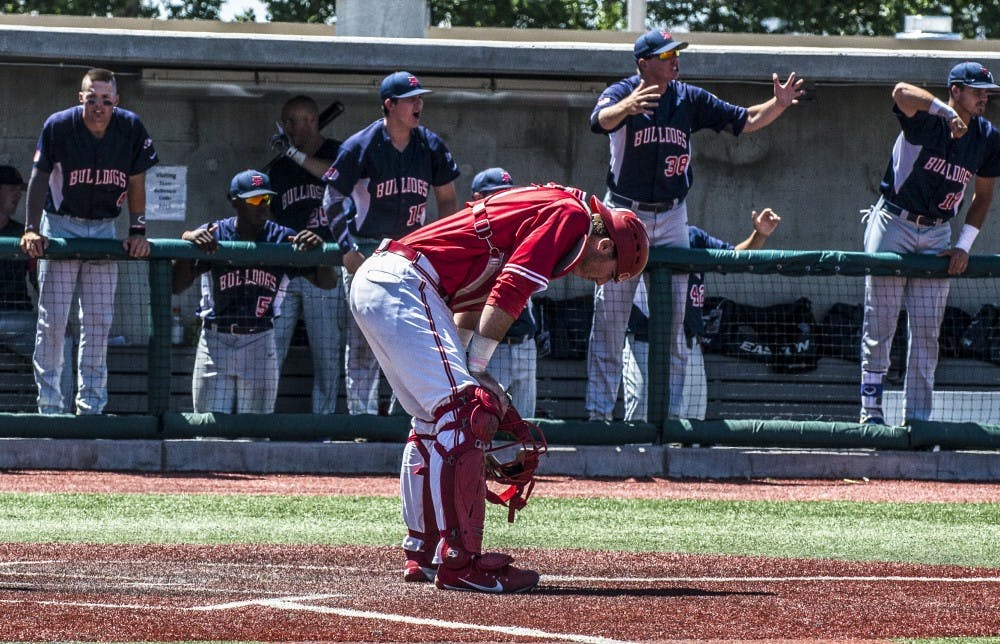 Lobo catcher Daniel Herrera hangs his head after a two run pick up in the 5th inning by the Fresno State Bulldogs. Fresno State's 11-5 victory over the Lobos advanced them to the finals to meet No. 2 San Diego State Aztecs. The Lobos finished their season with a 30-27-1 record on Saturday, May 27th.