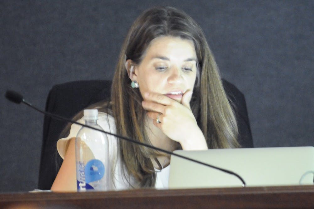 Bernalillo County Clerk Maggie Toulouse Oliver works on her laptop at Civic Plaza. Toulouse Oliver, a Democrat, ran against Republican incumbent Dianna Duran for Secretary of State of New Mexico.
