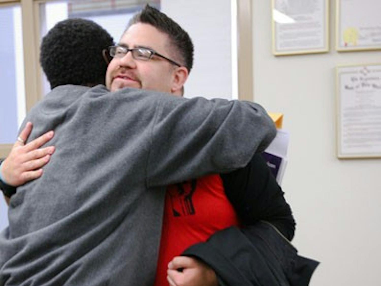 Tarance LeNoir, left, congratulates Christopher Ramirez, who was elected GPSA president Friday.